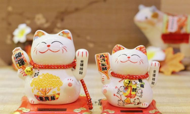 招财猫举左手表示什么意思